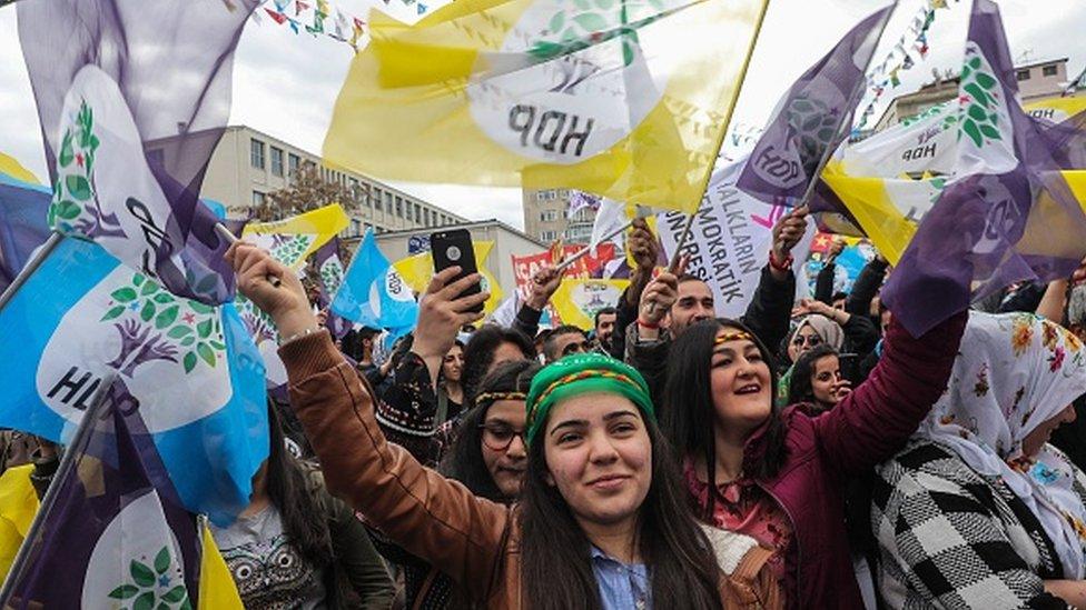 Supporters of Turkey's main pro-Kurdish HDP party cheer during a campaign rally in Ankara in 2019