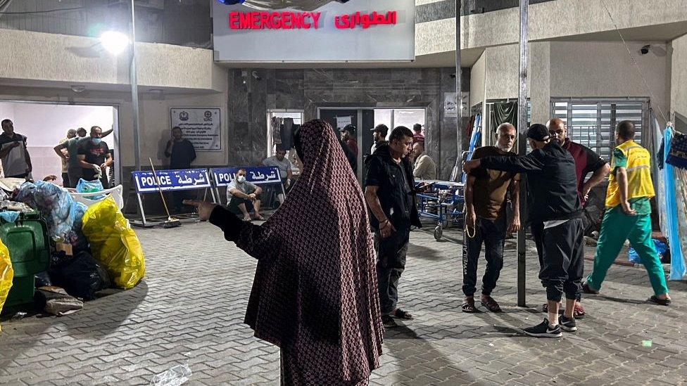 People stand outside emergency ward at Al-Shifa - 10 November