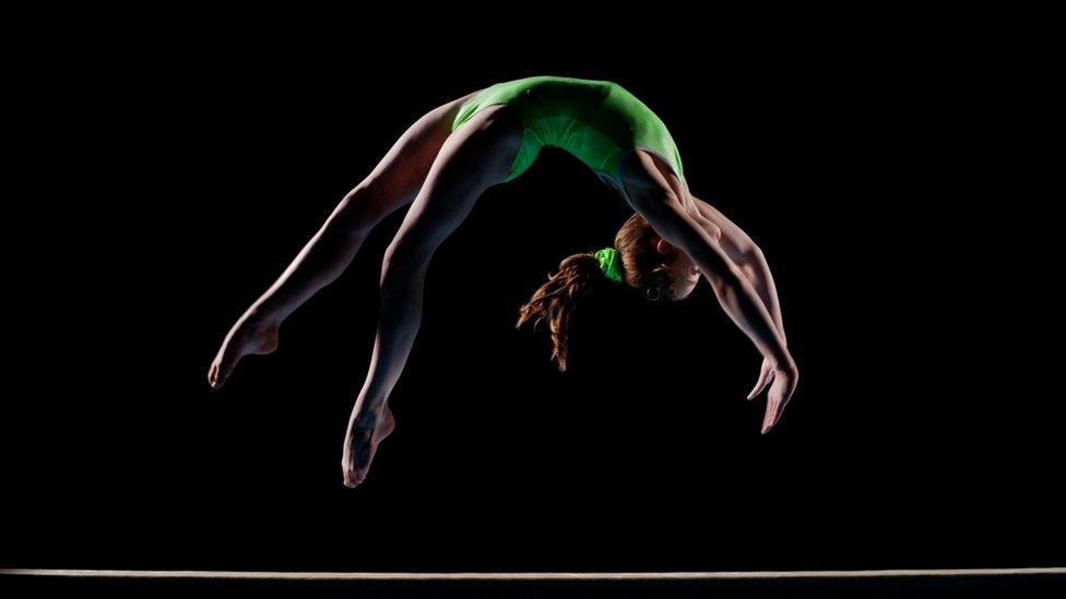 backflip on black background