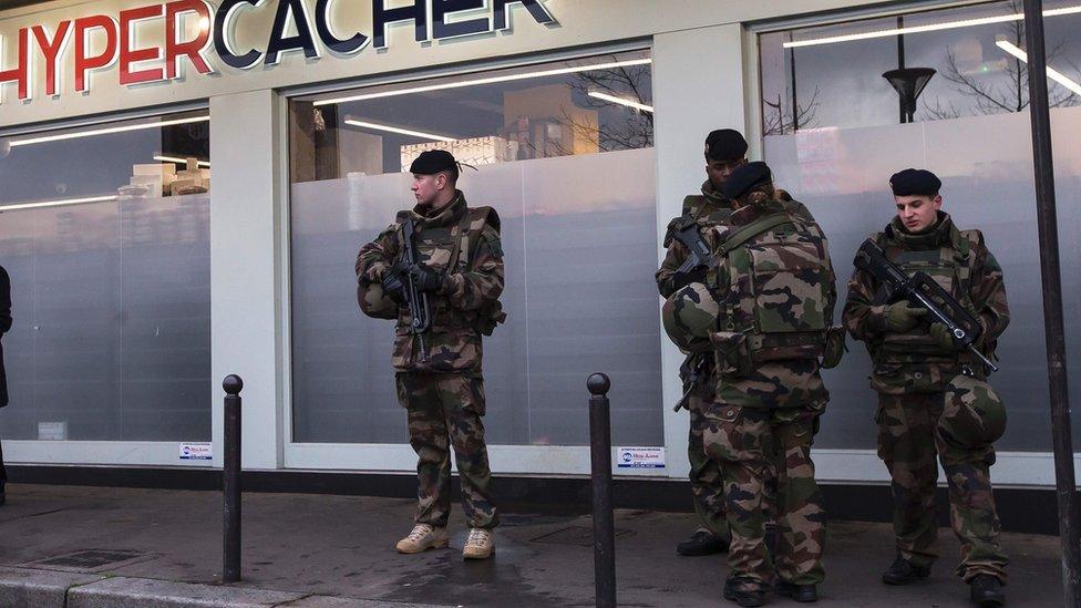 Soldiers protect kosher supermarket attacked in January 2015 in France