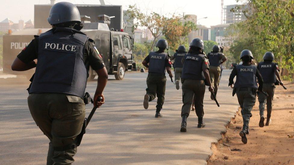 Riot-police in Abuja charging at a #BringBackOurGirls rally