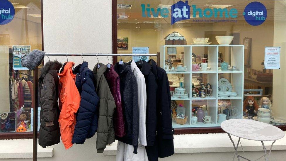 Coats on a rail outside the Live at Home charity shop