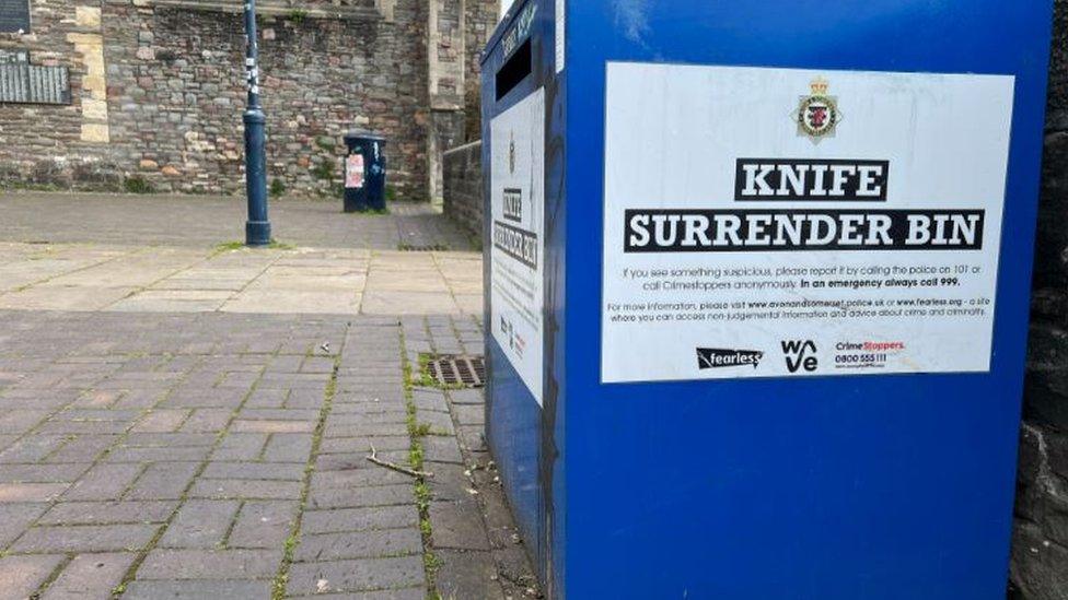 A blue knife surrender bin