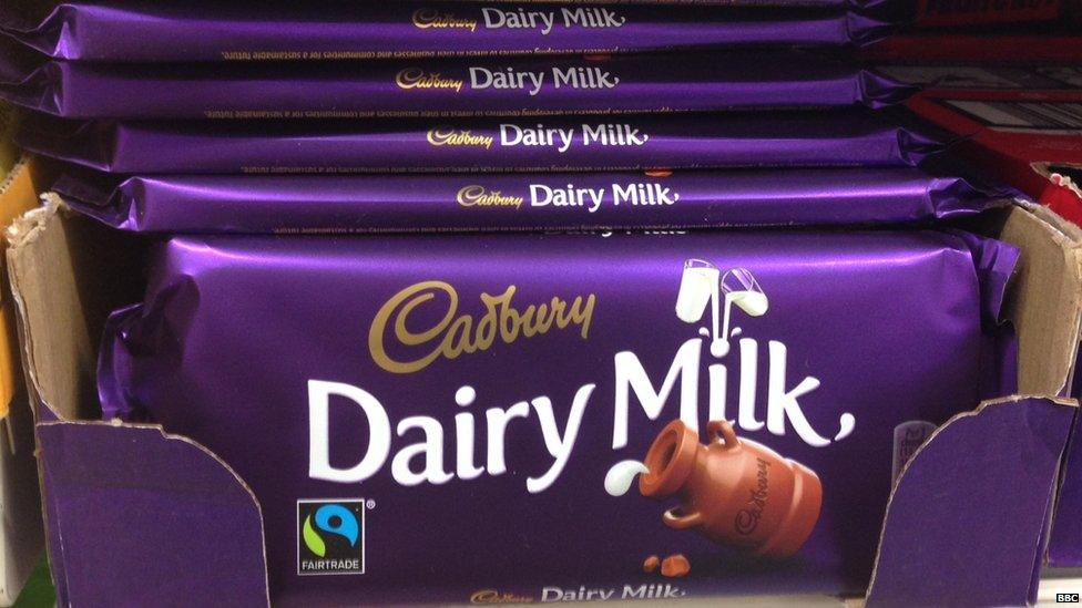 Cadbury dairy milk bar on supermarket shelf.