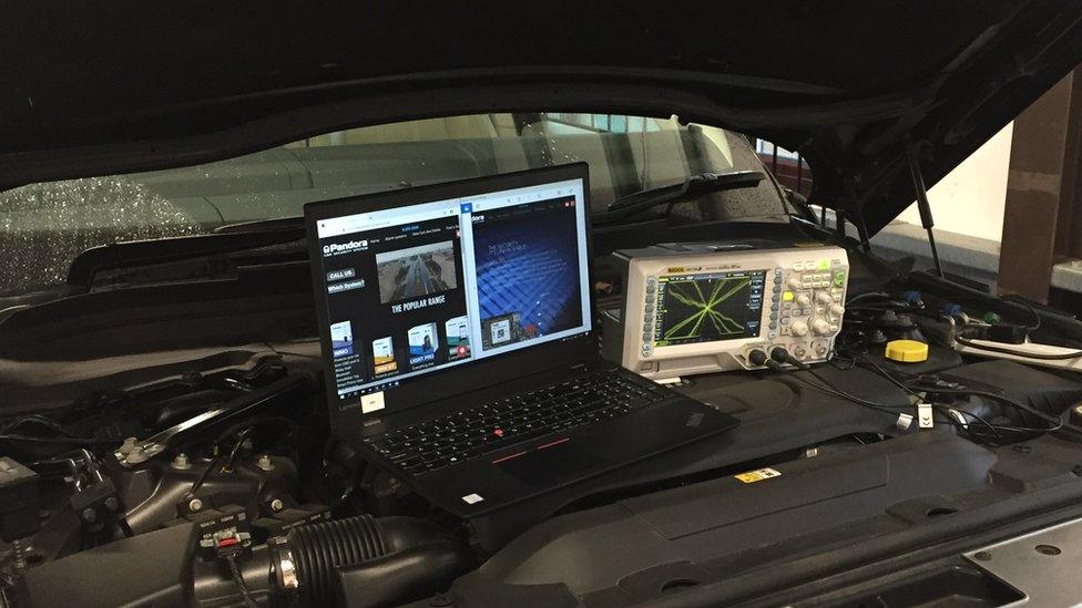 Laptop on car engine