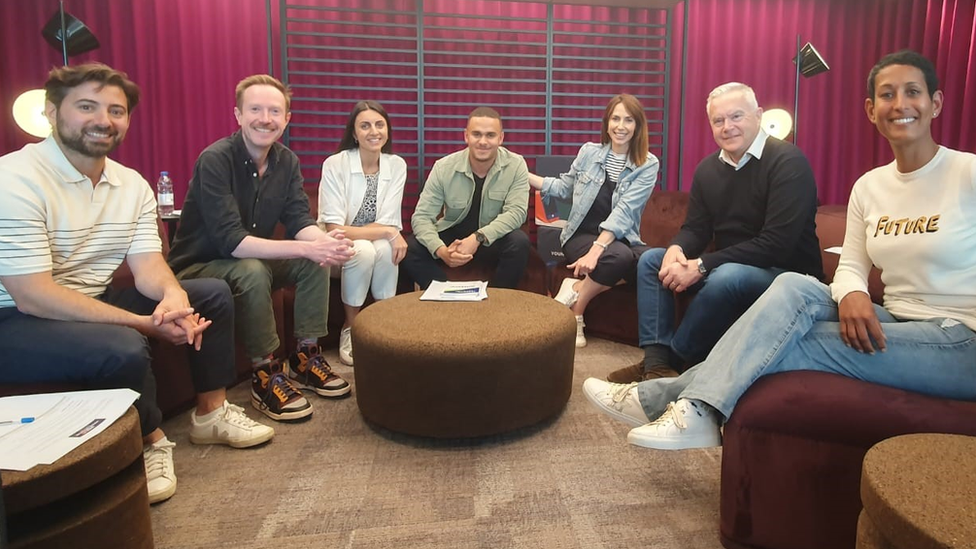 BBC Young Reporter Competition 2023 judges. From left to right: Ricky Boleto, Adam Fleming, Pria Rai, Ashley John-Baptise, Alex Jones, Huw Edwards, Naga Munchetty