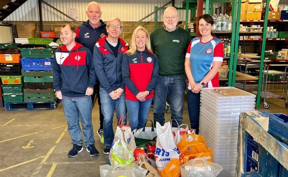 Members of Harlow Running and Tri Club dropping off items to Harlow Food Bank