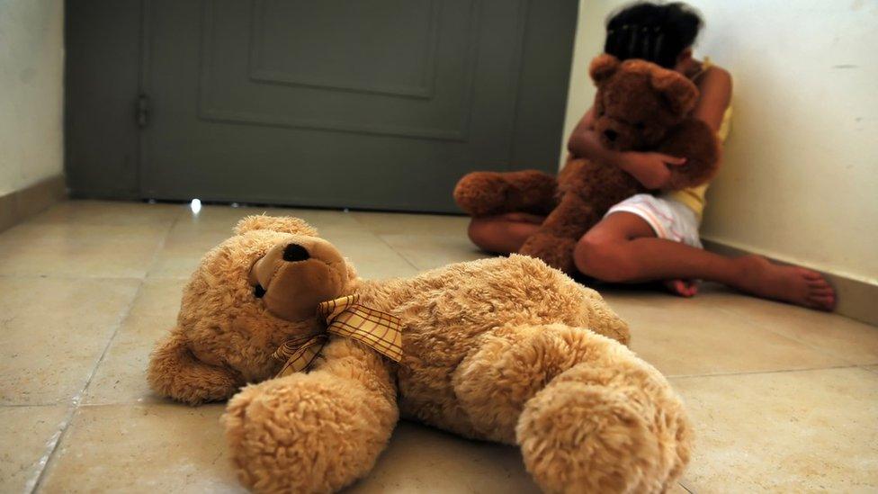 Child with teddy bear