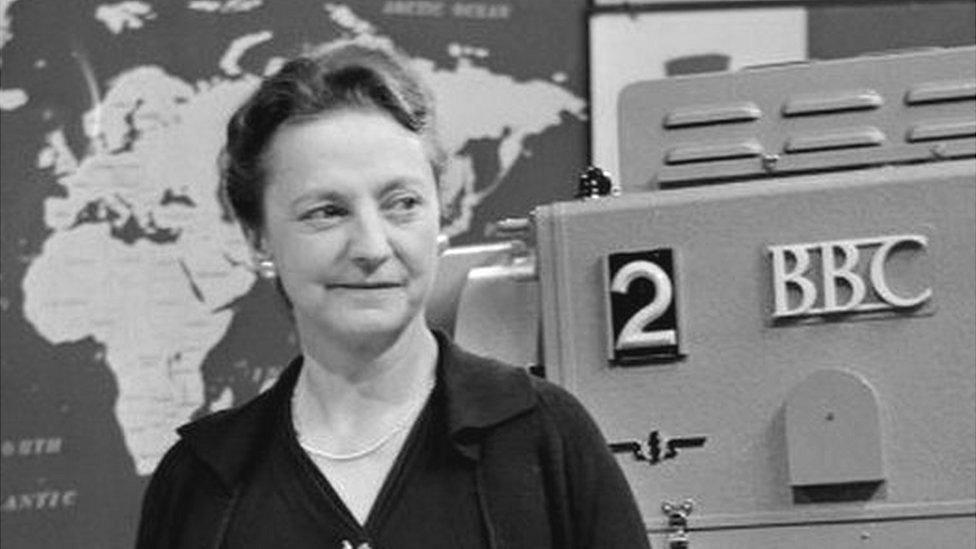 Grace Wyndham Goldie standing in front of a camera in a BBC television studio in 1958