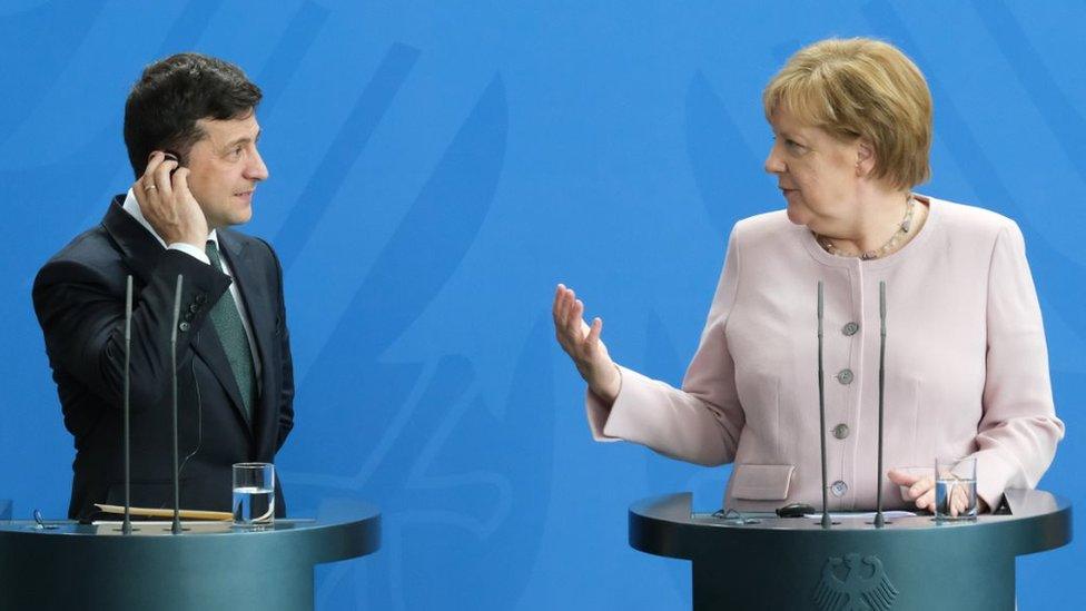 German Chancellor Angela Merkel and new Ukrainian President Volodymyr Zelensky speak to the media following talks at the Chancellery on June 18, 2019 in Berlin