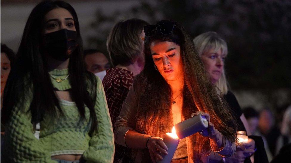 Members of the public attend a vigil in memory of Sabina Nessa,