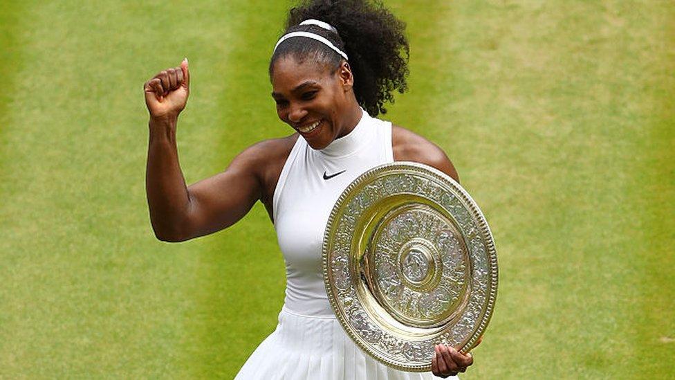 Serena Williams holding Wimbledon trophy