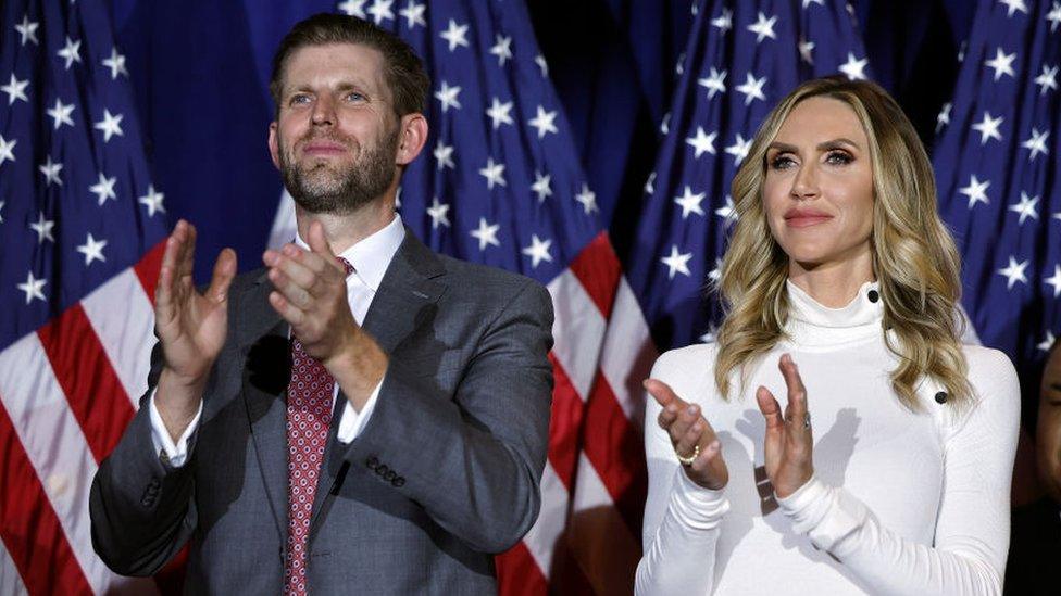 Eric Trump (L) and his wife, Lara Trump, applaud for Republican presidential candidate and former U.S. President Donald Trump, during a primary night party at the Sheraton on January 23, 2024, in Nashua, New Hampshire.