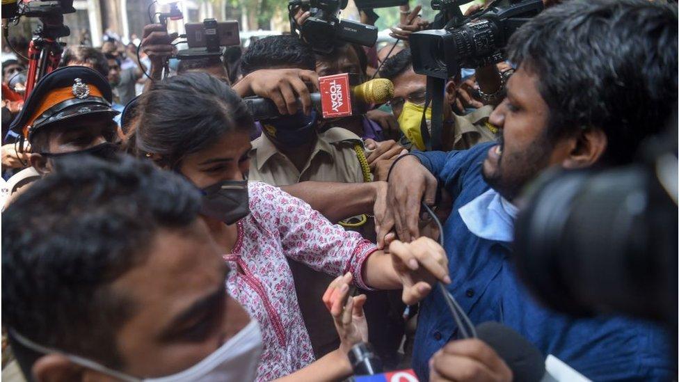 Rhea Chakraborty struggles with the media as she arrives at the Narcotics Control Bureau (NCB) office