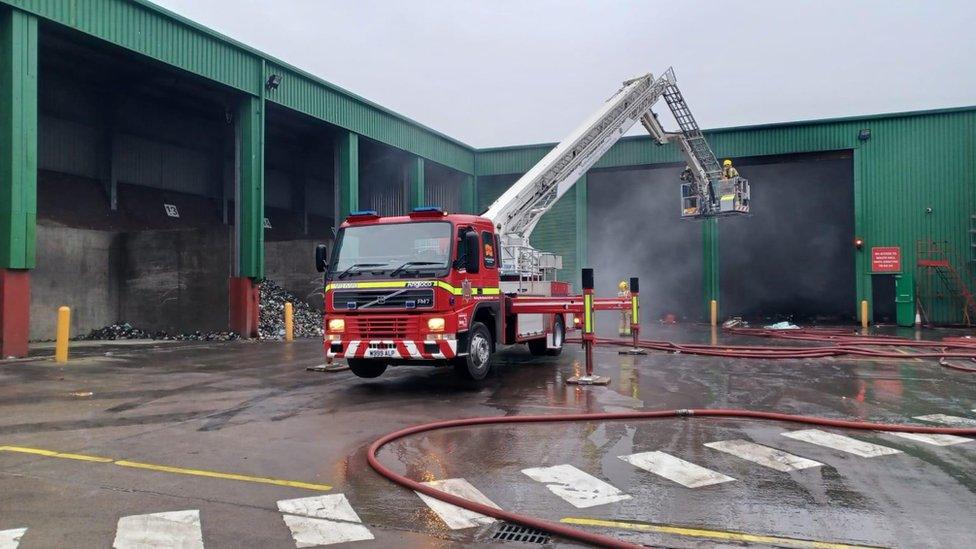 Fire crews and engine at the scene of the fire