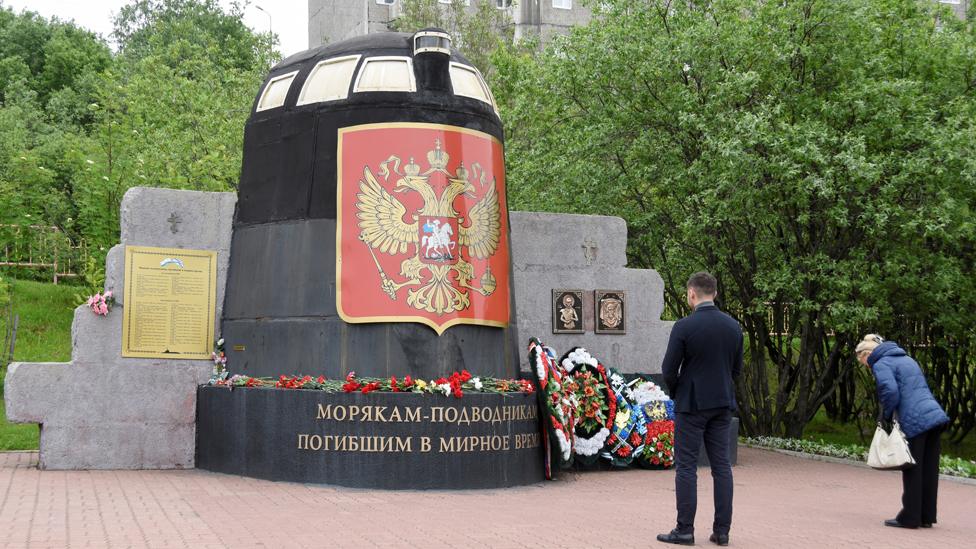 Flowers at memorial to submariners in Murmansk, 3 Jul 19