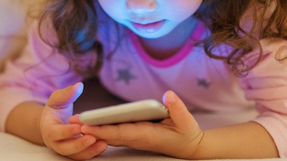 Young child with smartphone