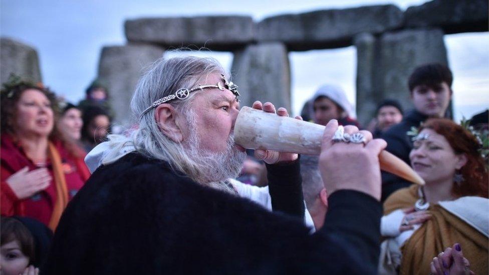 Man drinks from horn