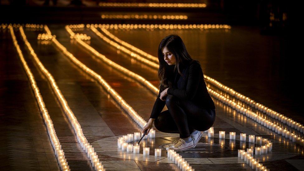 Holly Wilson, whose grandmother Ada Wilson passed away during the pandemic, stands in Belfast Cathedral before a remembrance service in partnership with Marie Curie for their National Day of Reflection, to mark the 2,100 people who have lost their lives to Covid in Northern Ireland