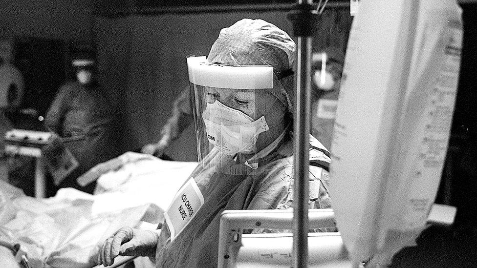 ICU charge nurse Morag Malcom monitors the breathing of a patient.