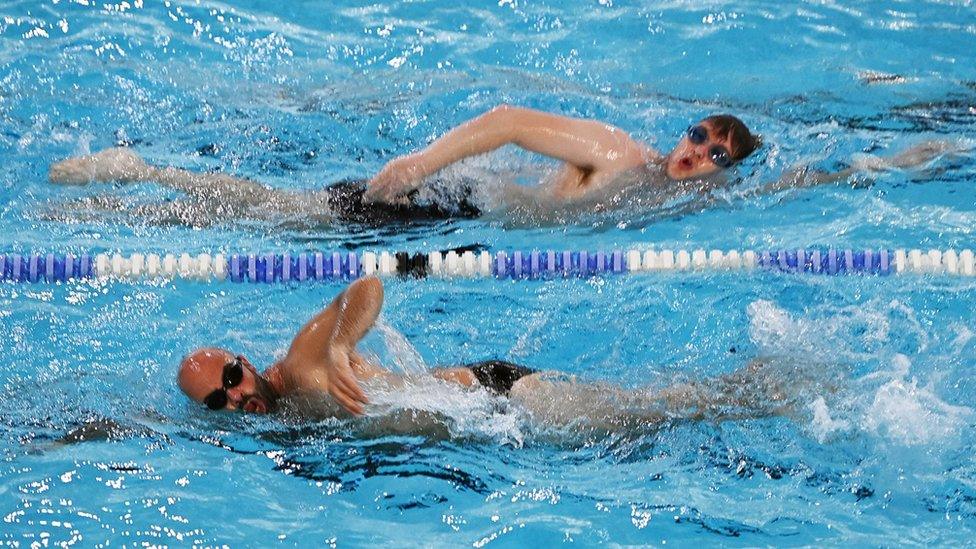 Two men in a swimming pool