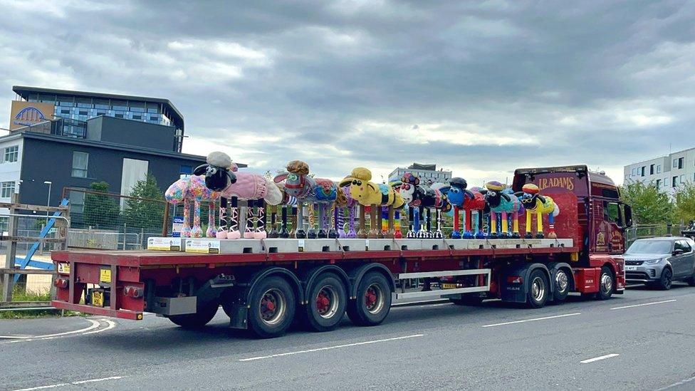 Multiple Shaun the Sheeps on a lorry