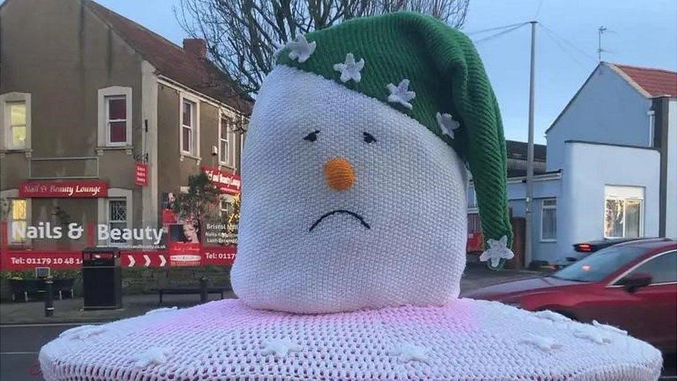 A sad snowman post box topper