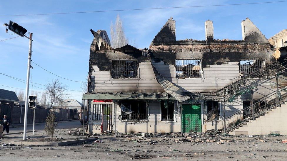 View of burnt houses and property in the village of Masanchi