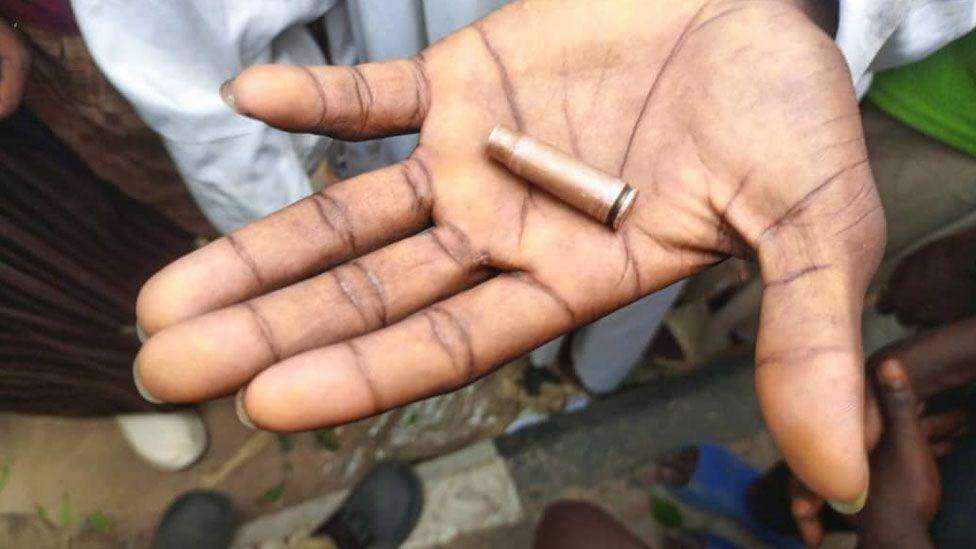 A protester in Kano holding a spent bullet cartridge - 1 August 2024