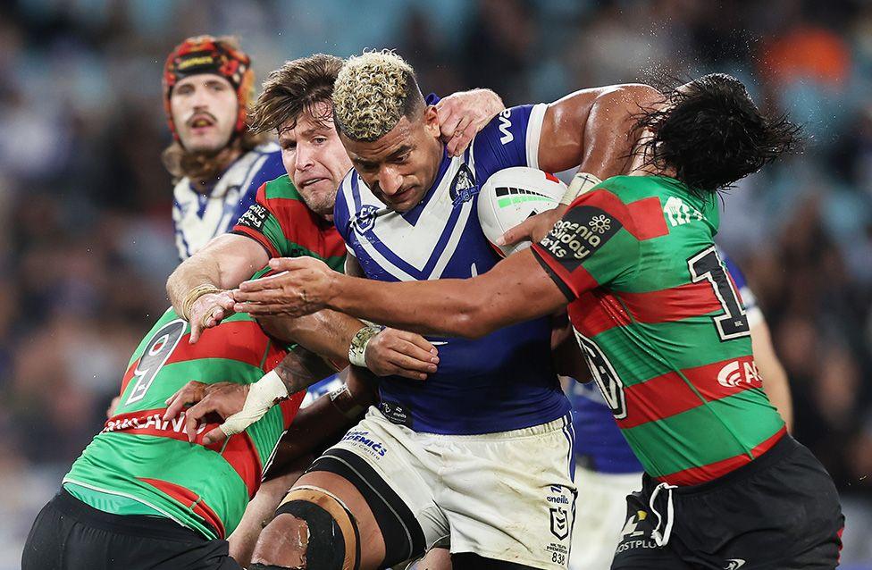 Bulldogs Viliame Kikau is tackled during the match between South Sydney Rabbitohs and Canterbury Bulldogs. Photo by Matt King