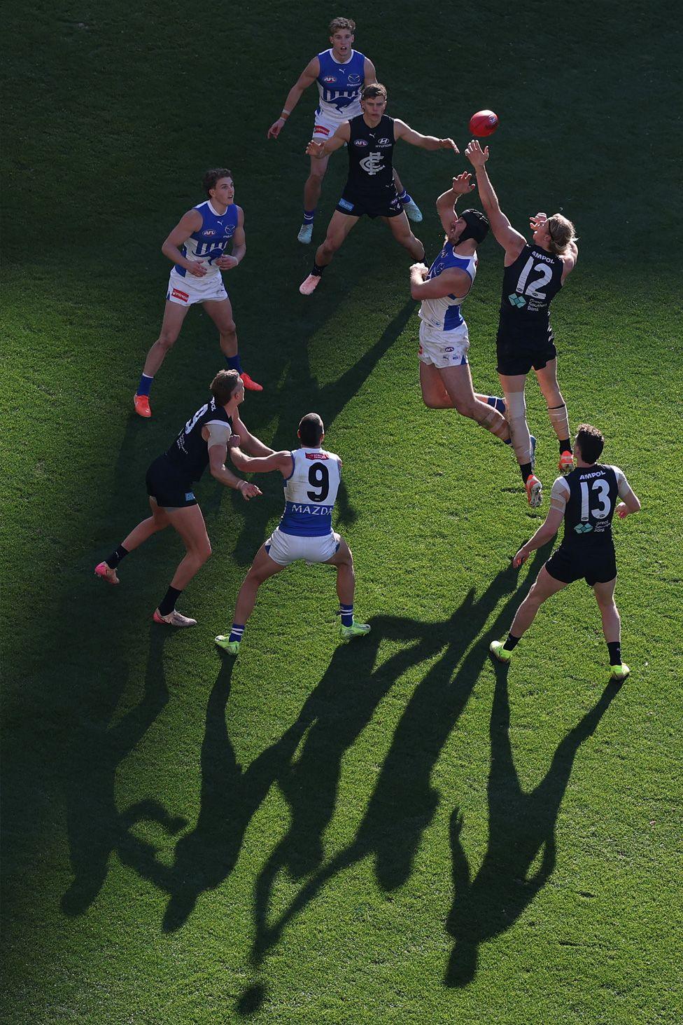North Melbourne Kangaroos'  Tristan Xerri competes with Carlton Blues' Tom De Koning at the Melbourne Cricket Ground. Photo by Robert Cianflone