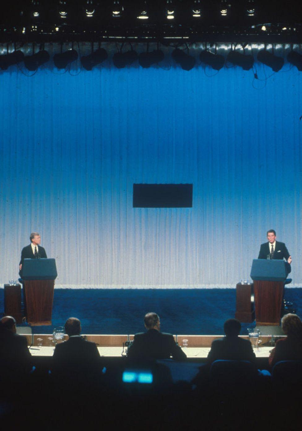 Jimmy Carter and Ronald Reagan debate each other from separate podiums October 31, 1980 prior to the 1980 presidential election.