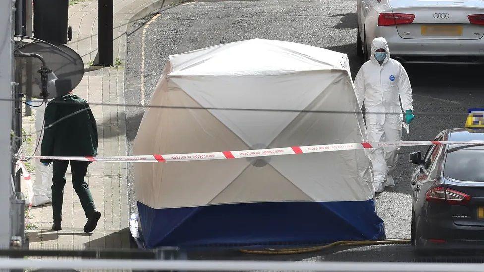 Forensics teams outside murder scene in Derry