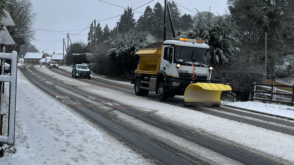 Snowy streets with a snow plough