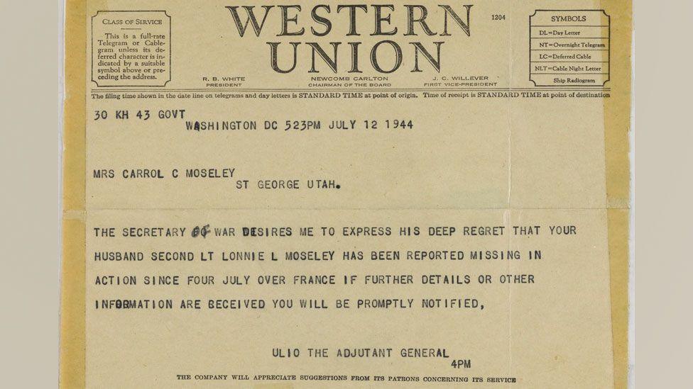 A Western Union telegram informing Carrol (sic) Moseley her husband was missing in action. It is light yellow and has Western Union in capitals along the top and underneath is typed details, including the date, who it's addressed to and brief details about when Lt Moseley was posted missing.