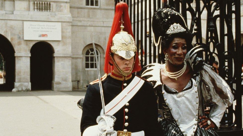 transvestite having her picture taken with a member of the Household Cavalry at Buckingham Palace during Lesbian and Gay Pride, London, 24th June 1995.