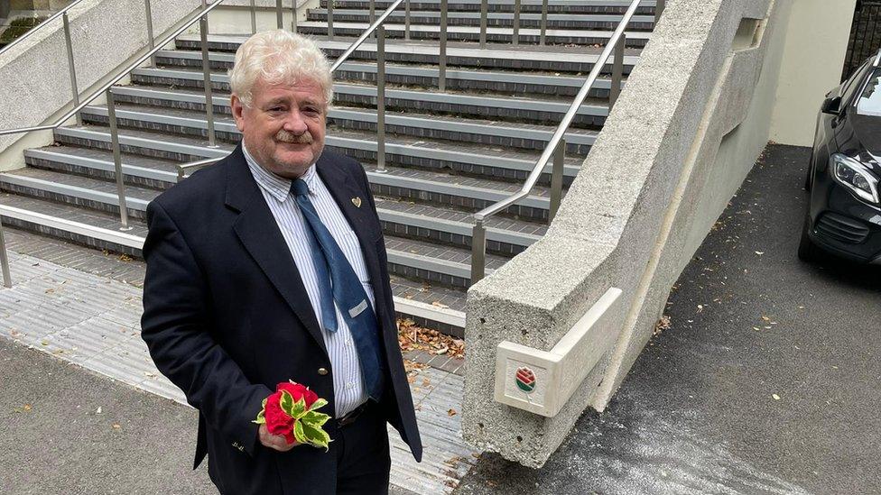 Paul Stewart stands in front of refurbished stairs