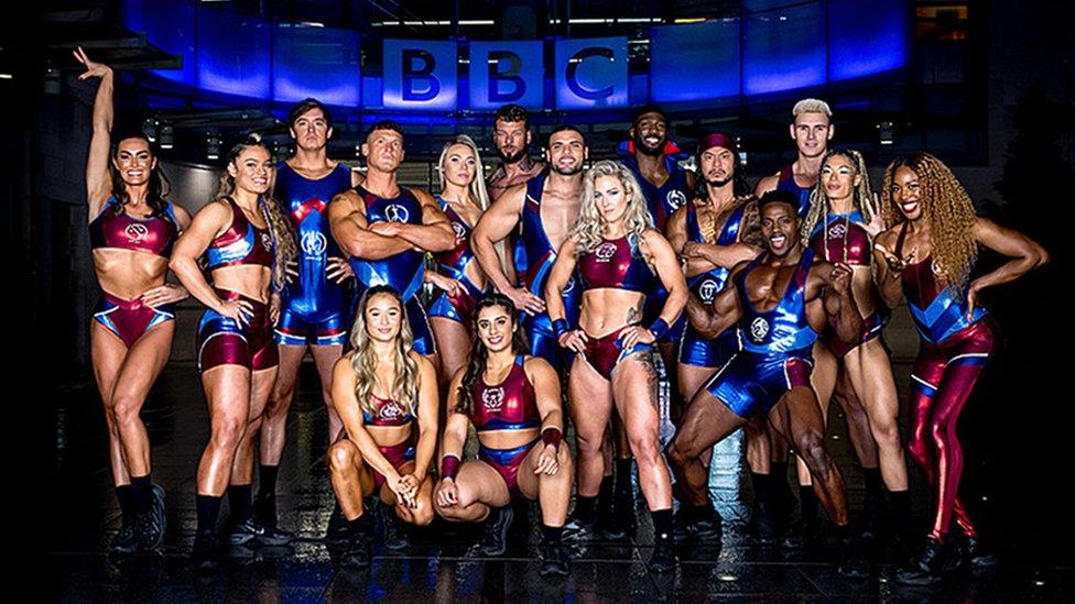 the gladiators posing in front of the bbc