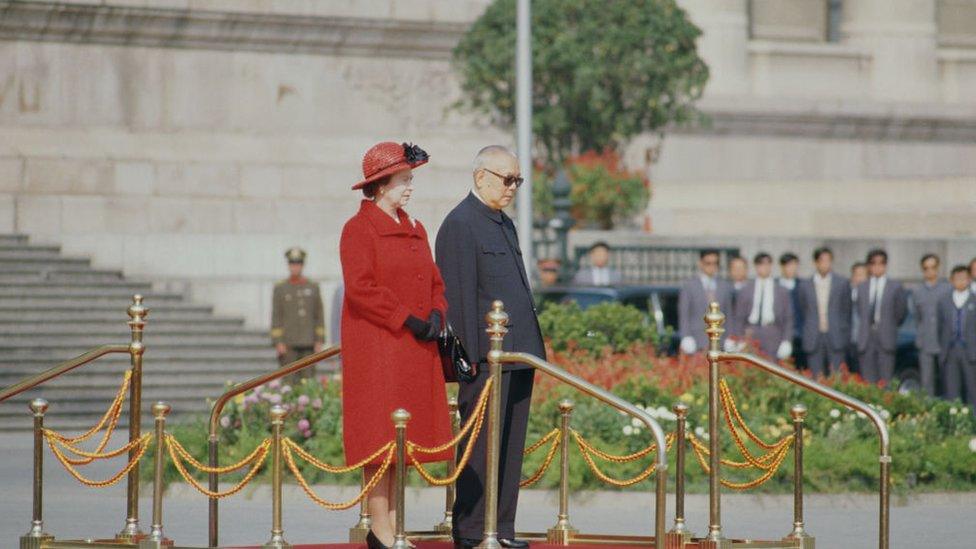 Queen Elizabeth II and Li Xiannian (1909 - 1992), the President of the People's Republic of China, standing outside the Great Hall of the People in Beijing during the Queen's visit to China, 13th October 1986