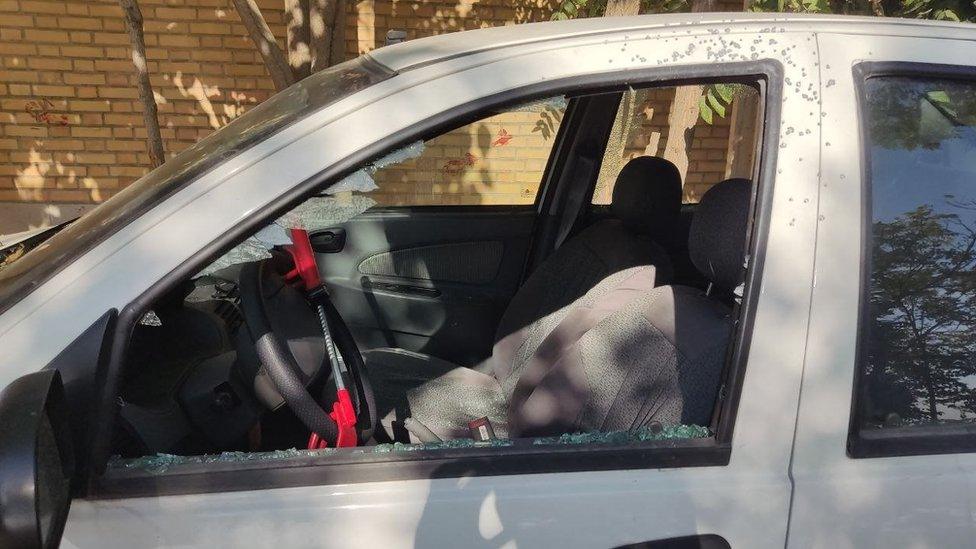 Photo from Vahid Online showing a car damaged by birdshot in Karaj, Iran (3 November 2022)