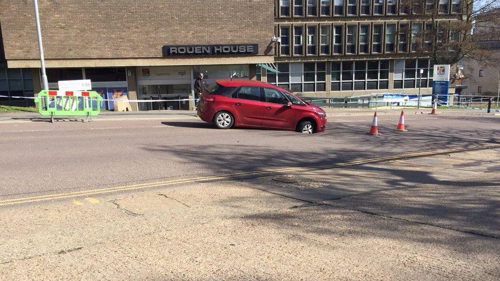 Car stuck in hole