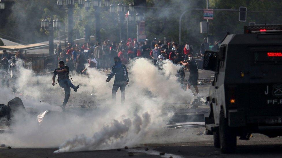 Demonstrators clash with soldiers in Santiago