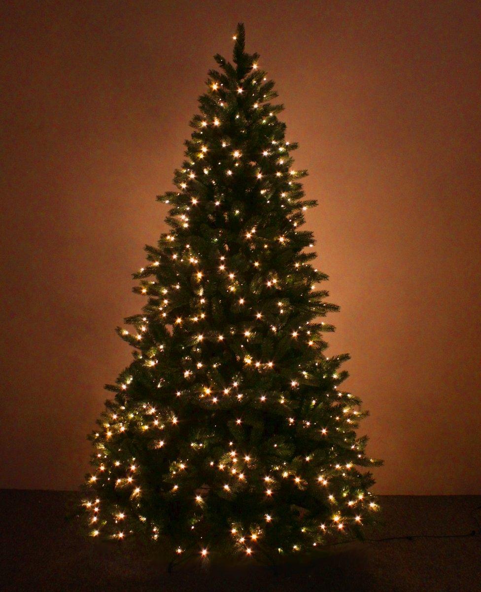 A pre-lit artificial Christmas tree