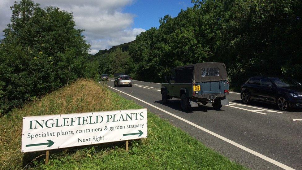 Mr Tullis says his sign is well looked after and he adds he tends to the grass to keep it neat