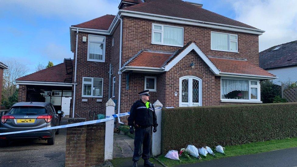 House with police cordon outside