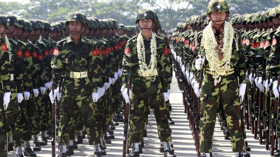 Myanmar soldiers attend a ceremony marking the country"s 67th Armed Forces Day