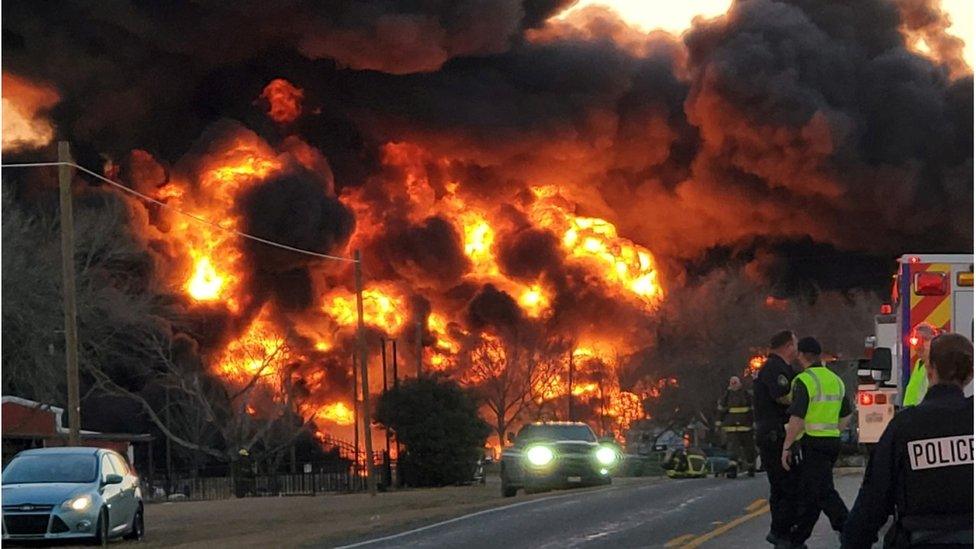 A fire at the location of a collision between a train and truck in Cameron, Texas, 23 February 2021