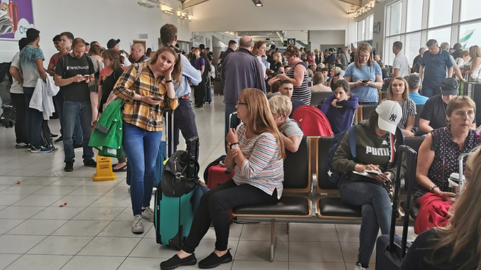 People waiting at Birmingham Airport