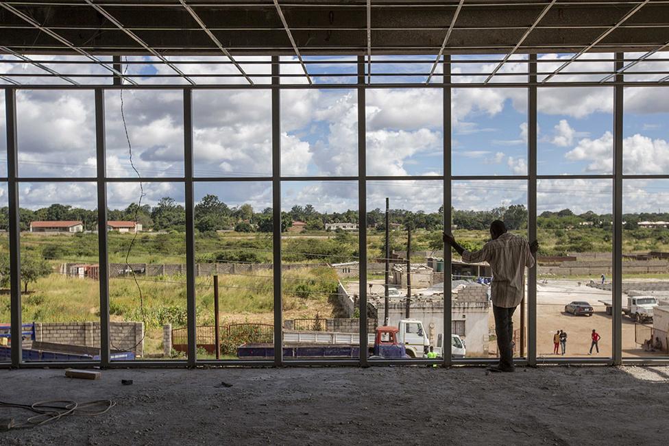 Construction worker in a shop being built