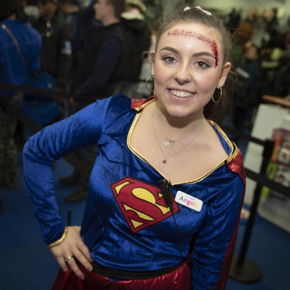 Girl dressed up as Superwoman